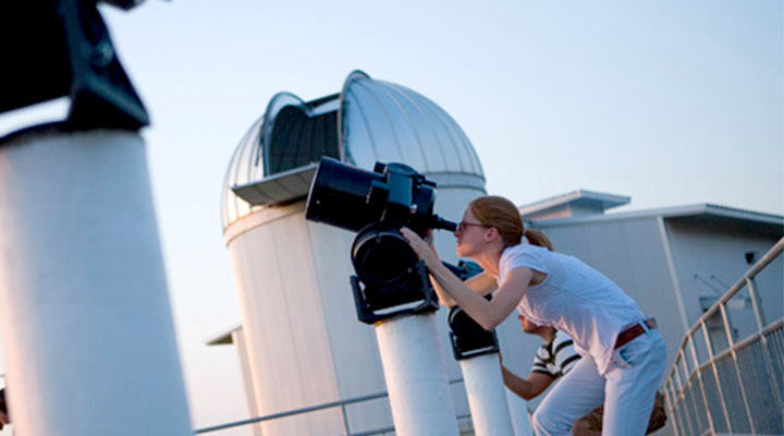 Student using a telescope